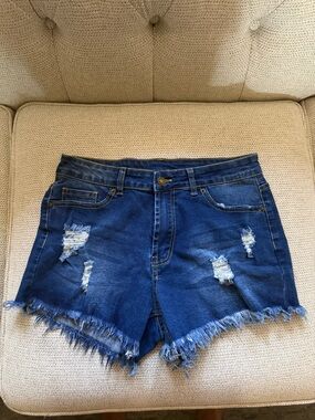 High-Rise Distressed Denim Shorts in Dark Blue